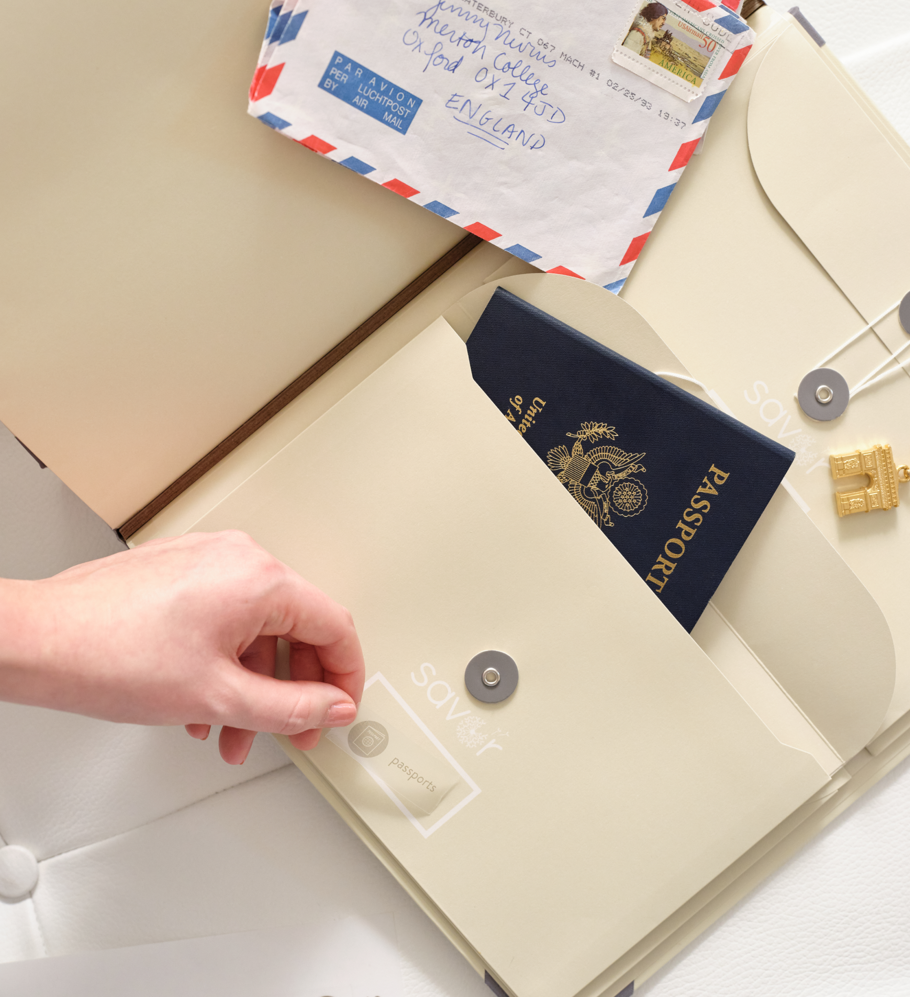 someone placing a label on one of the folio's envelopes.