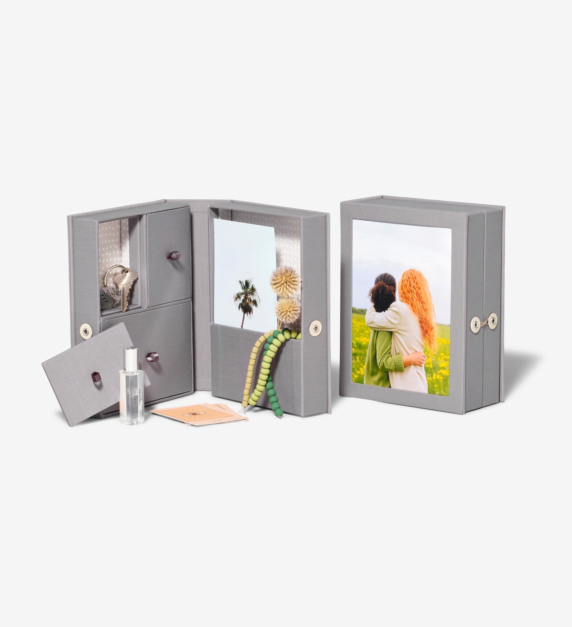 open slate travel story box, and closed slate story box next to each other.