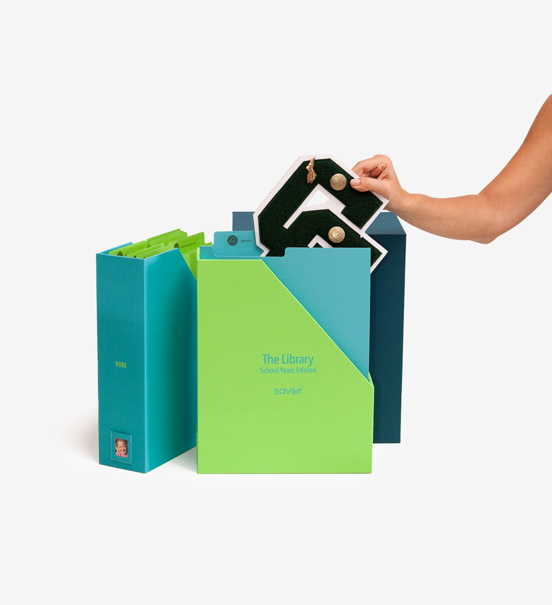 open ocean school years deluxe keepsake box with someone putting a drawing inside a folder.