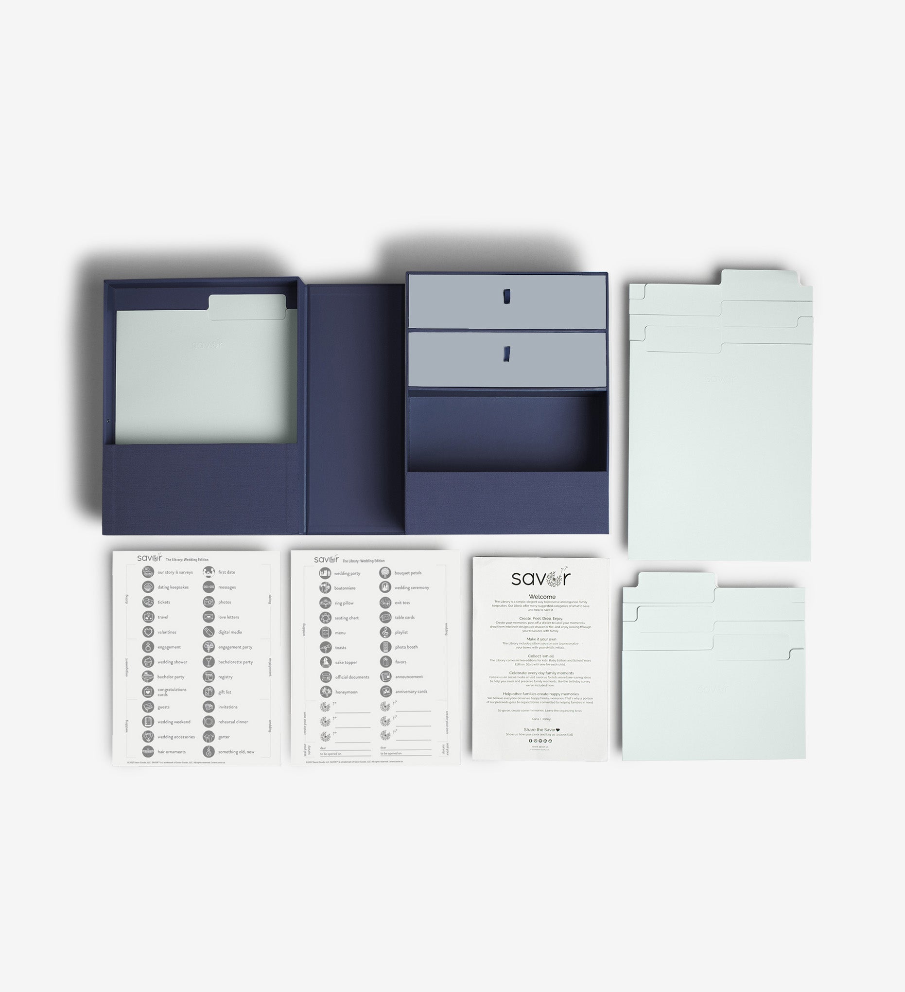 Something blue wedding vault keepsake box flat lay with two label sheets, a welcome letter, a set of big folders and a set of small folders