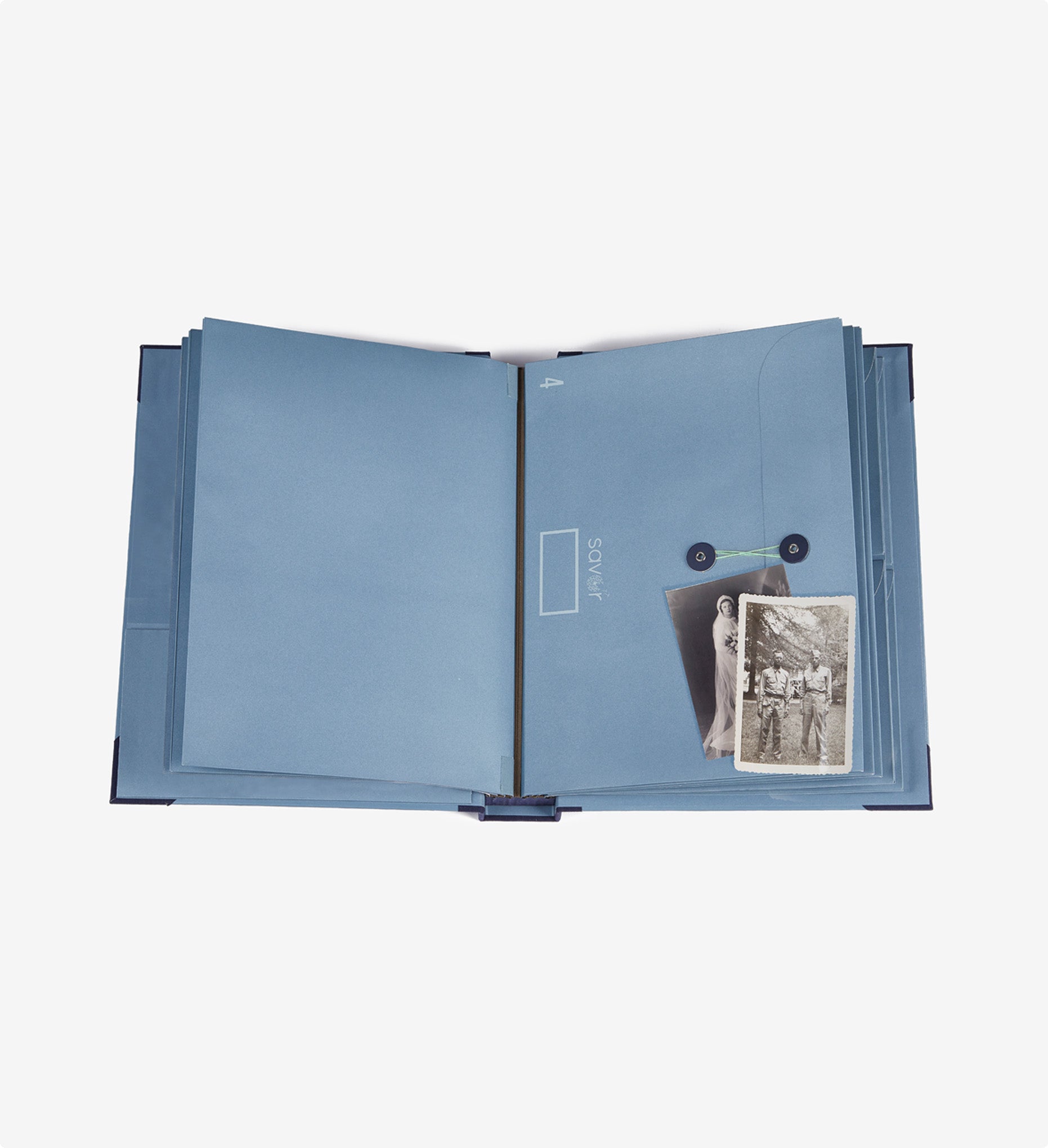 Savor blue folio document organizer open with black and white pictures on top of big envelopes