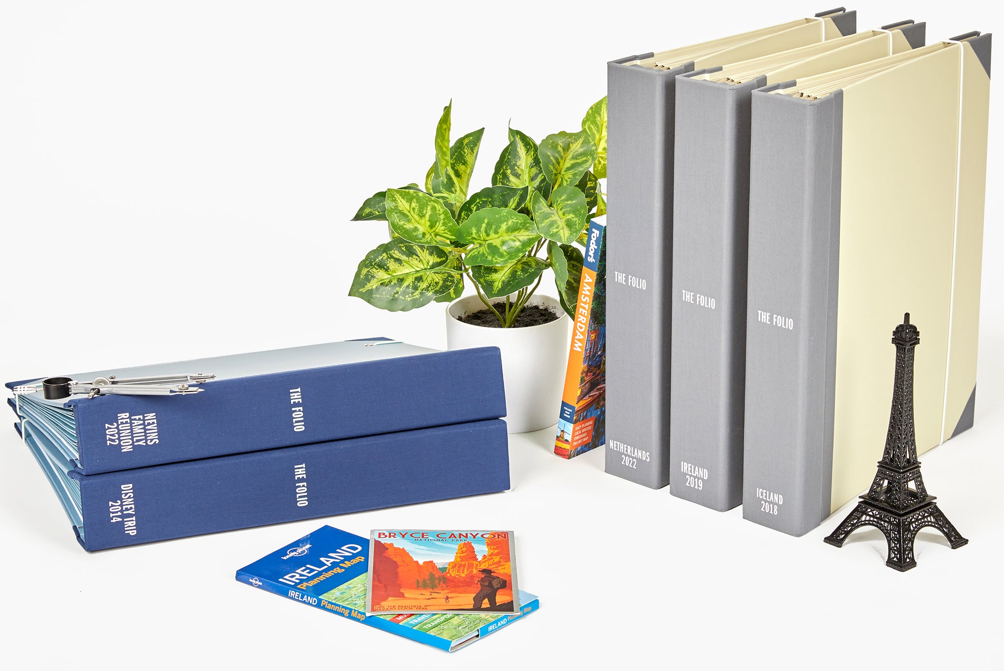 two something blue and three slate closed travel binders with props.