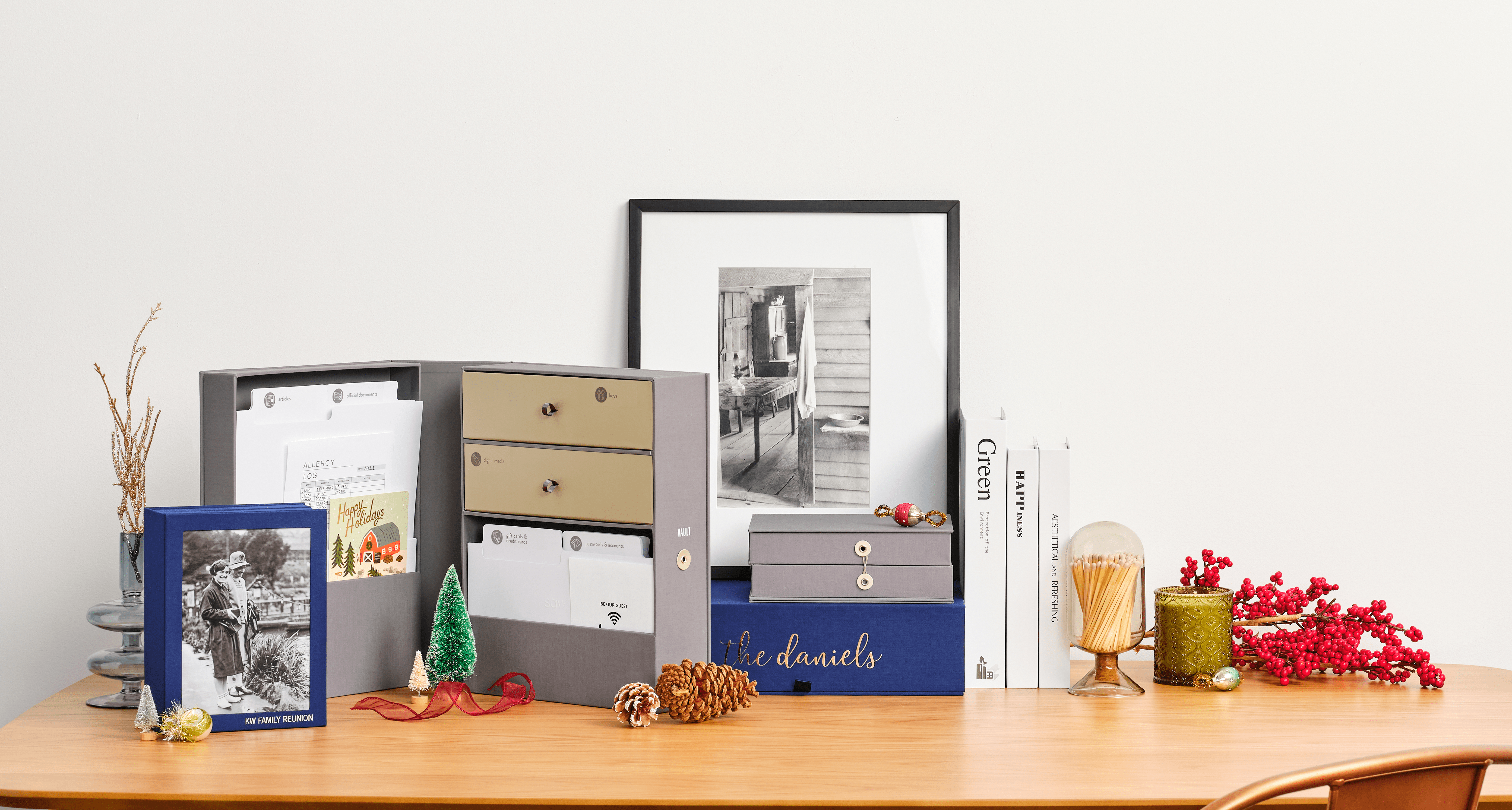 Grey and blue organization boxes with documents over a desk.