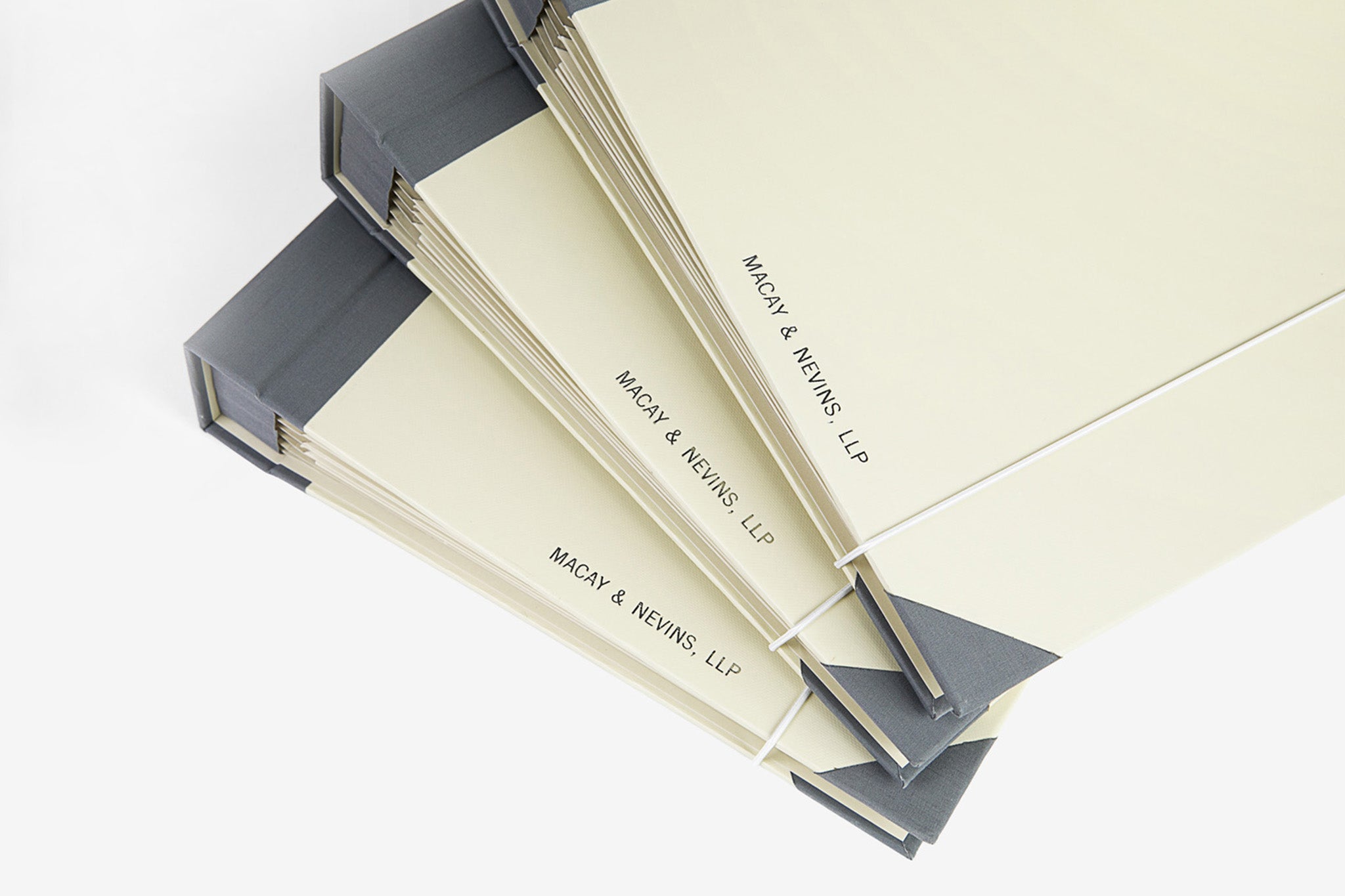 Close up of personalization in three folio document organizers stacked