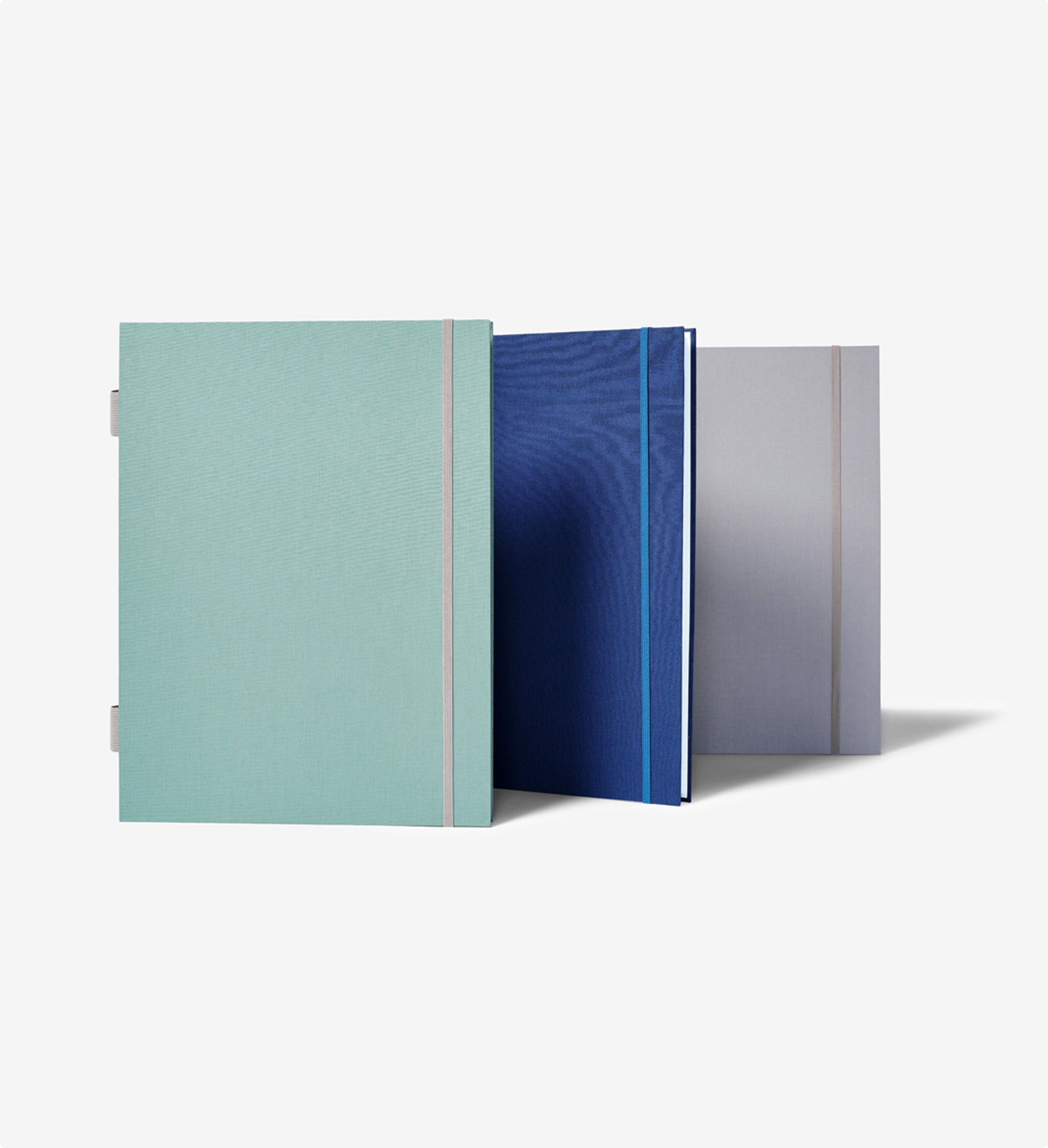 Closed fan folios, moss, blue and gray one alined in front of each other