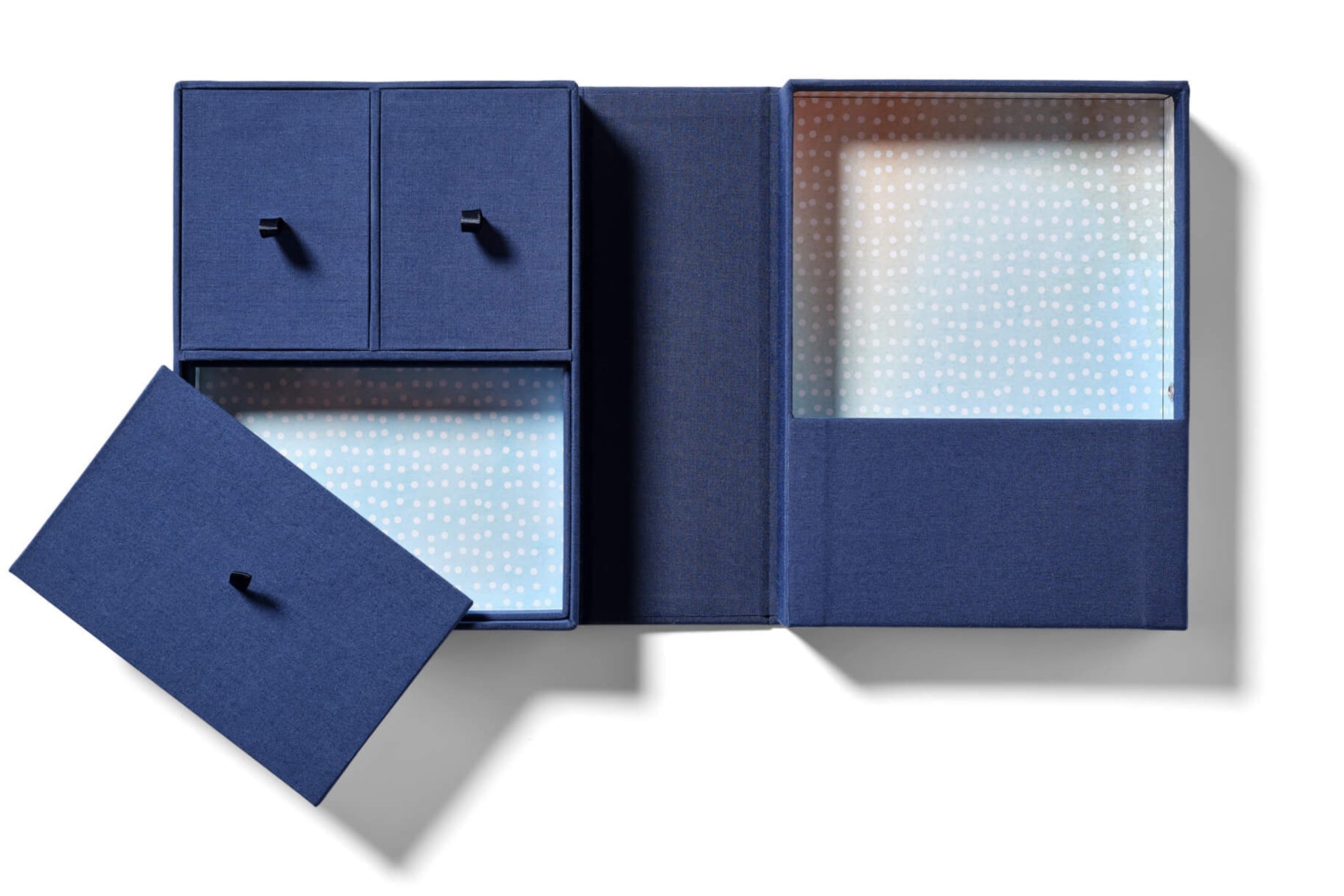 Dark blue keepsake box with light blue and pink interiors with white dots