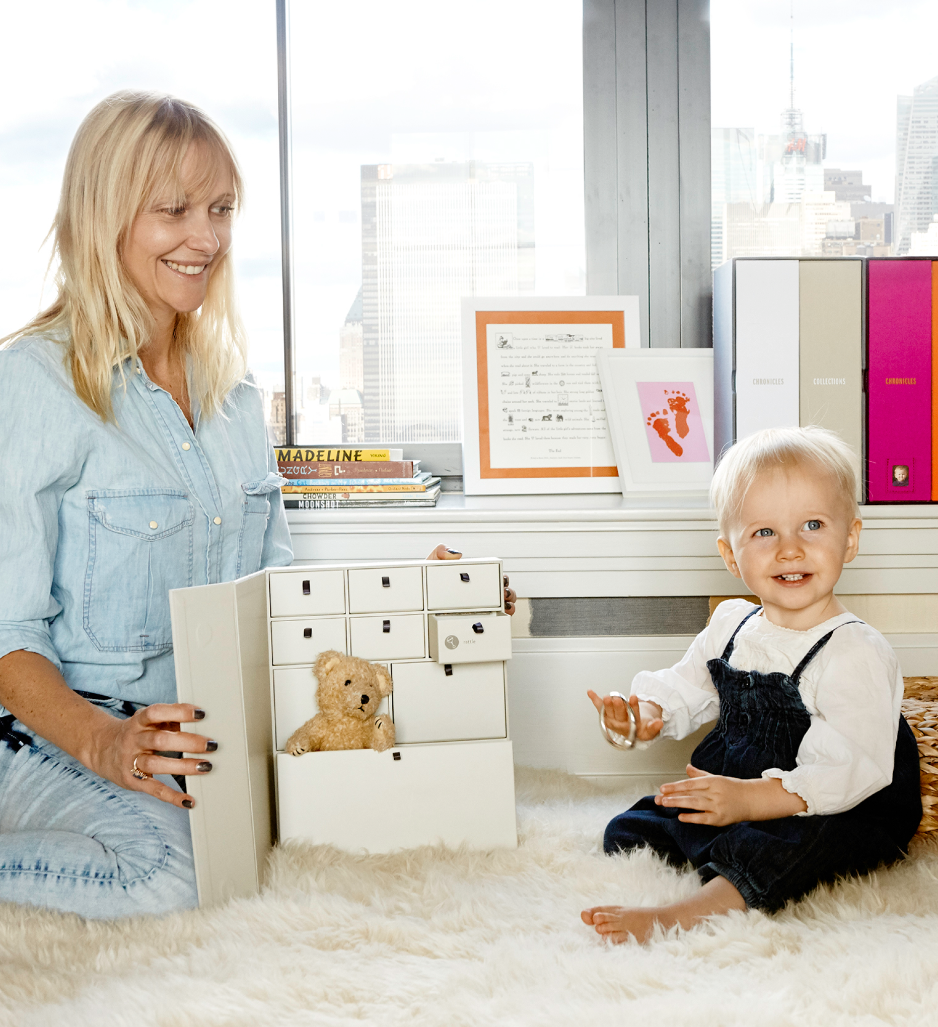 mom and baby holding a keepsake box.