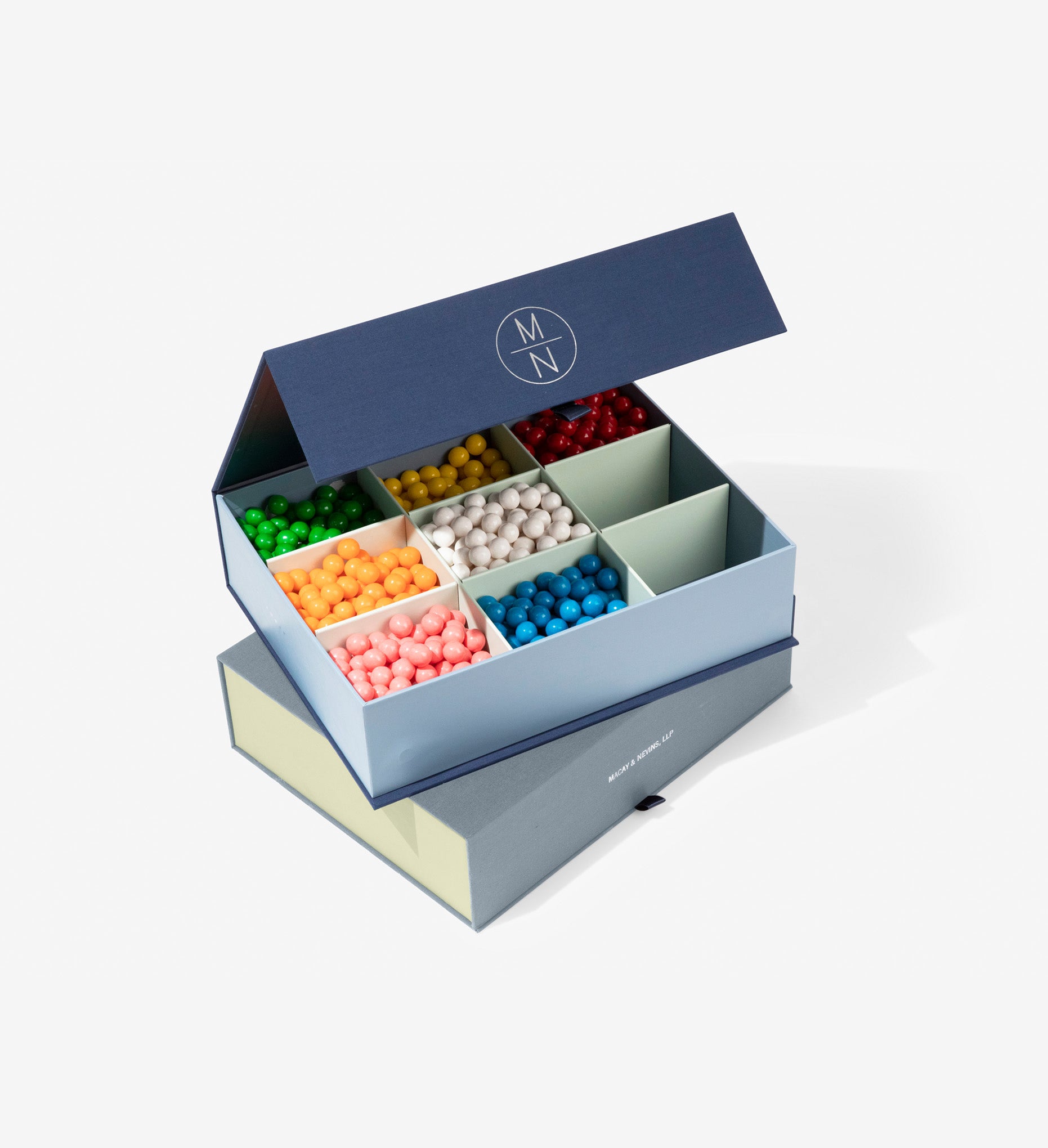 Open safe deposit box with candy on a closed one.