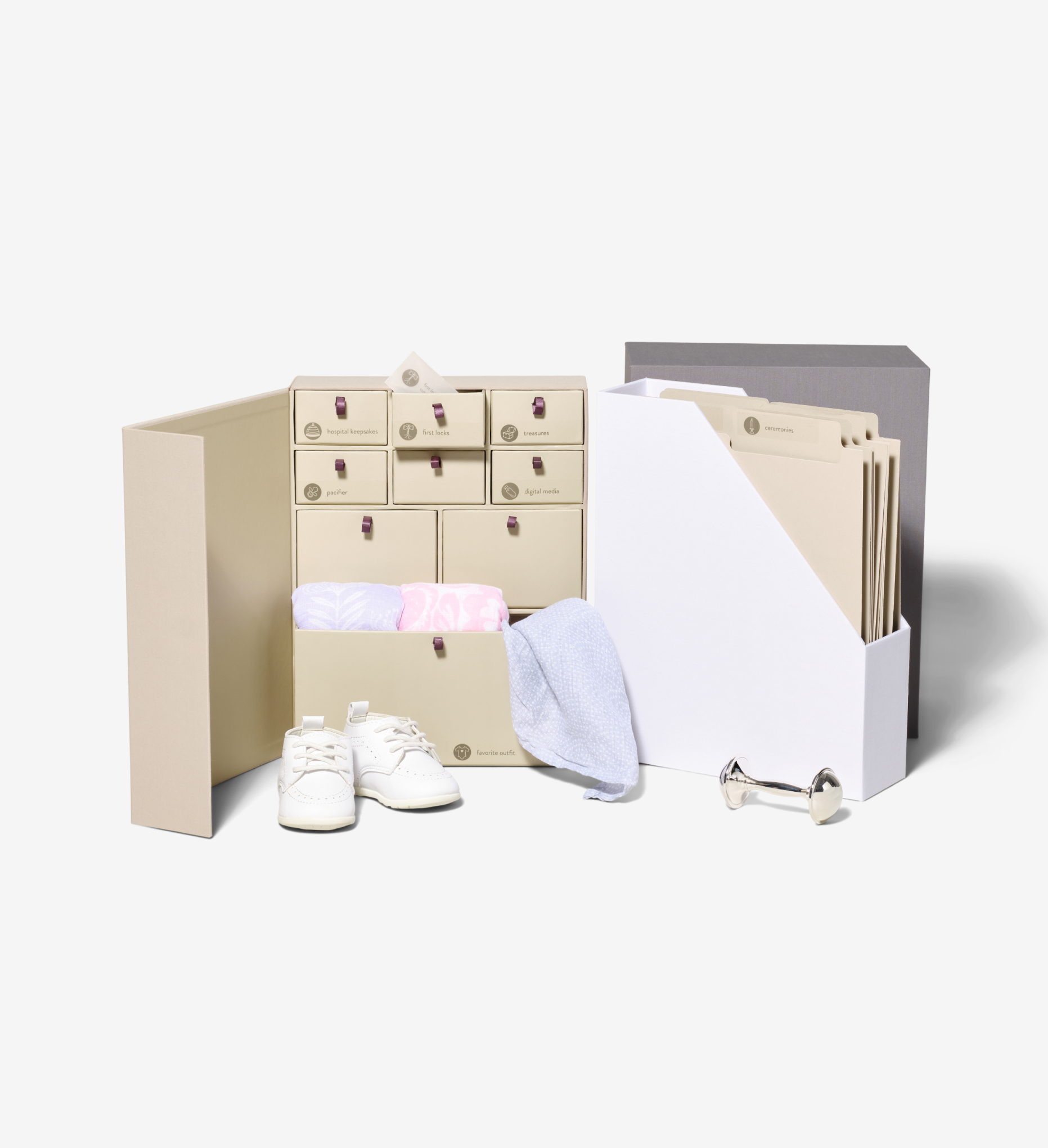 Savor deluxe baby keepsake box, interior boxes displayed: a beige box with drawers and a white compartment full of folders; baby mementos partially outside the drawers