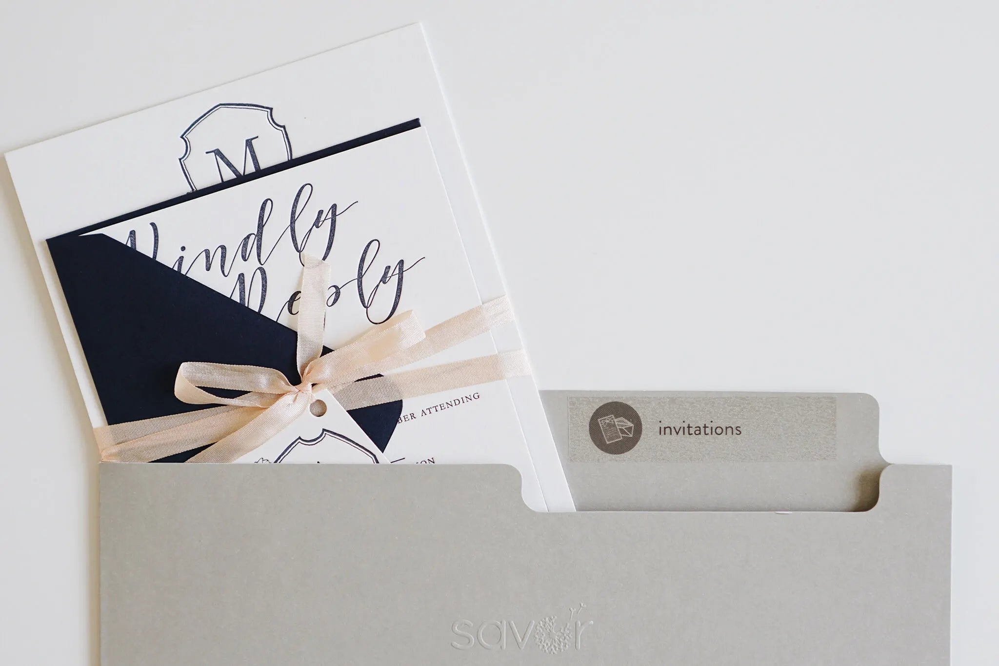 Wedding invitation on a dove folder.