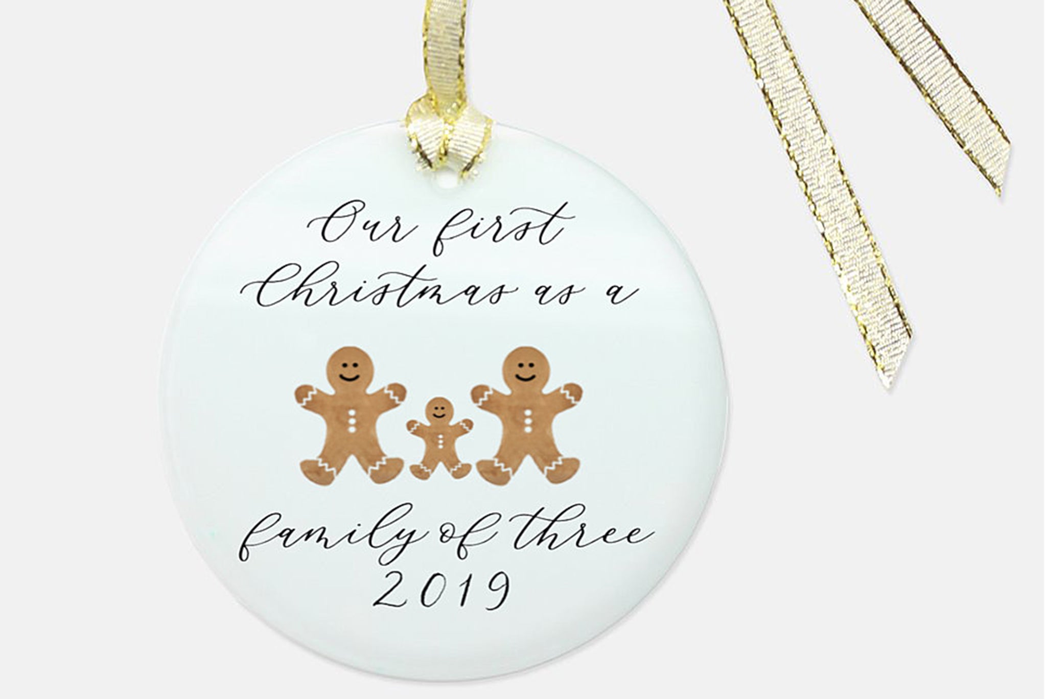 christmas ornament with a ginger bread cookies and a personalization in laura. 